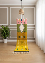 Yellow Moroccan runner rug in narrow hallway with fringe