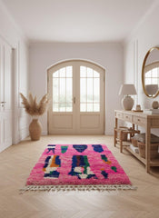 Colorful pink Moroccan rug in entryway