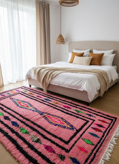 Bohemian pink area rug in cozy bedroom interior