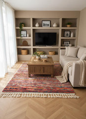 Moroccan rag rug with colorful stripes in a neutral living room