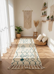 Cream Moroccan runner rug with teal diamond pattern in bright hallway
