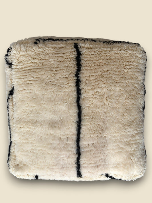 Beni Ourain style Moroccan floor cushion in cream with bold black stripe.