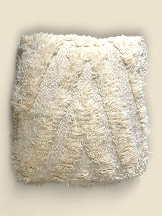 Cream Moroccan Berber pouffe with handwoven wool and textured chevron pattern,