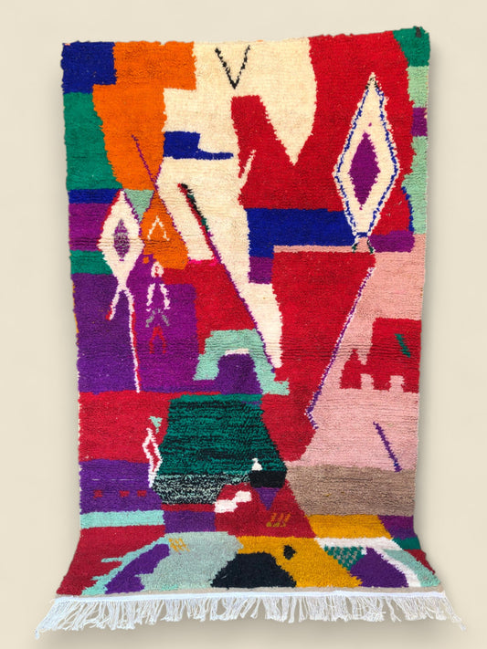 Full view of Asalas Moroccan rug with bold geometric shapes and bright colors
