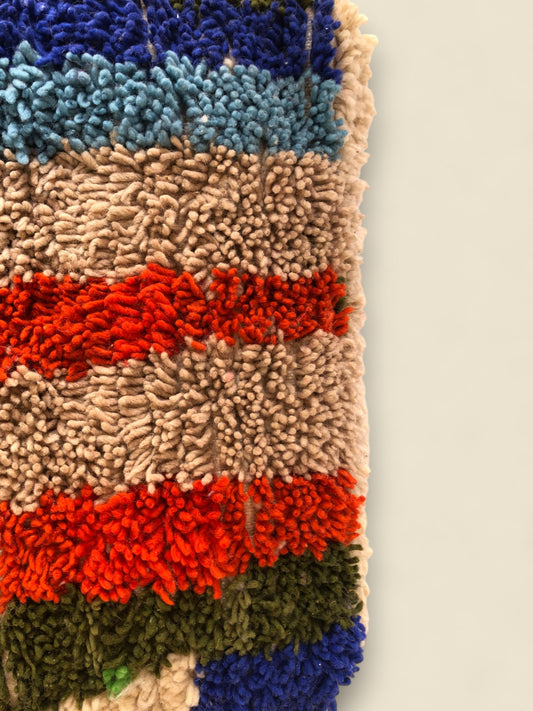 Tissilit pouffe with bold wool texture