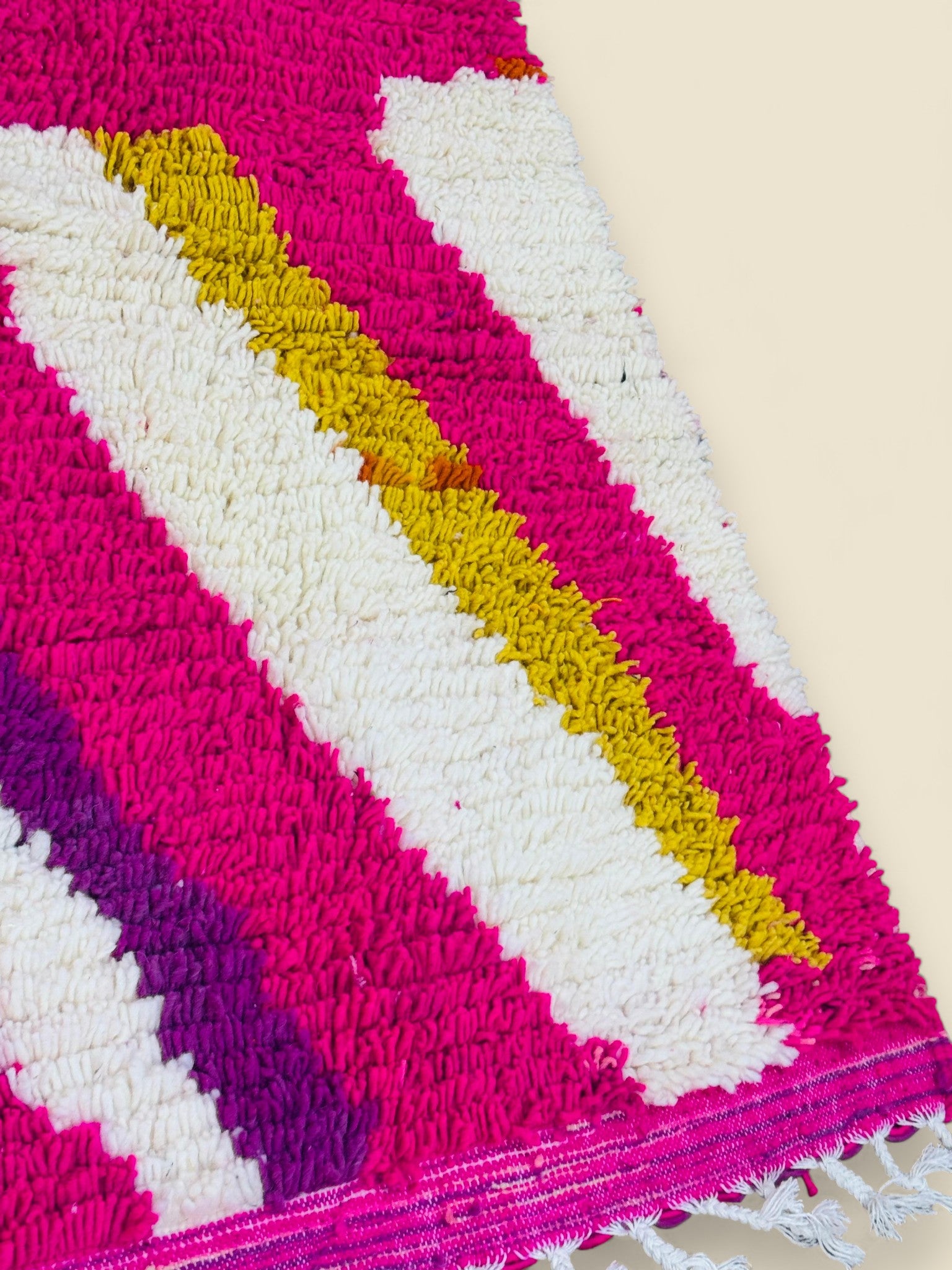 Abstract Moroccan rug with vibrant pink and yellow stripes