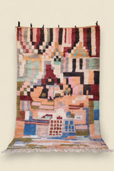 Full view of the Temzine Berber Rug showing handwoven abstract Moroccan design in warm earth tones and bold color blocks