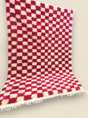 Handmade pink and white Moroccan rug with soft shag pile texture