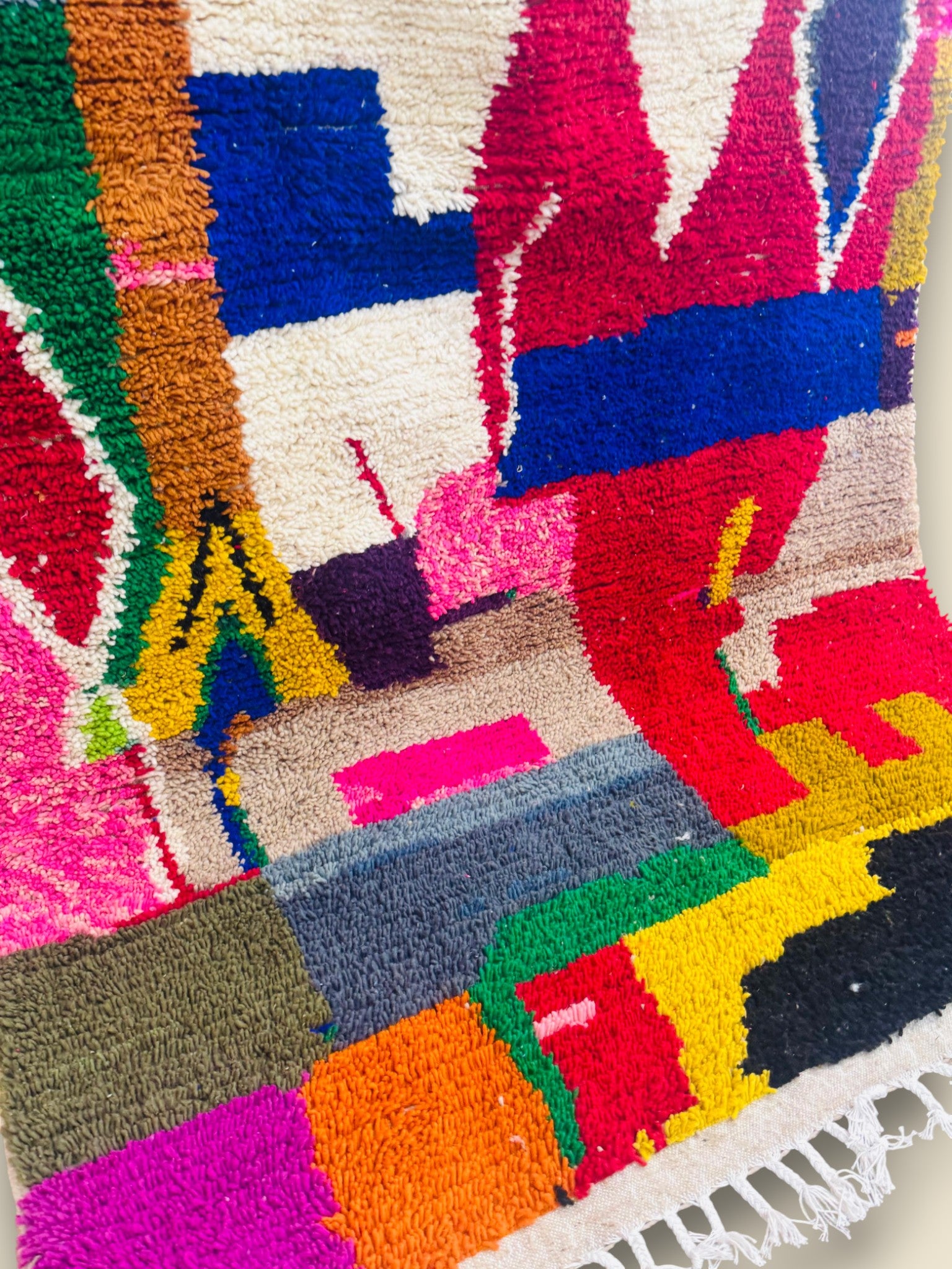 Close-up of Tawenza Berber rug showing vibrant wool texture.