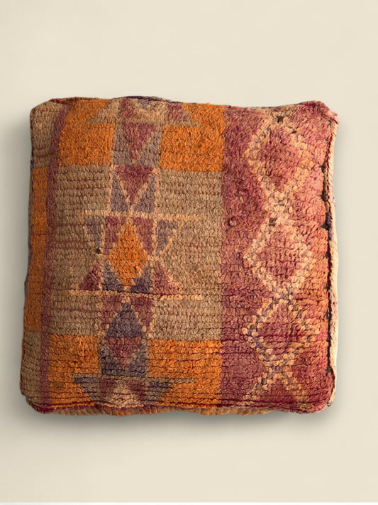 Square Moroccan floor pouffe with Berber motifs in earthy orange and beige tones