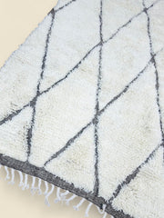 Close-up of Moroccan Tihya rug texture and fringed edge