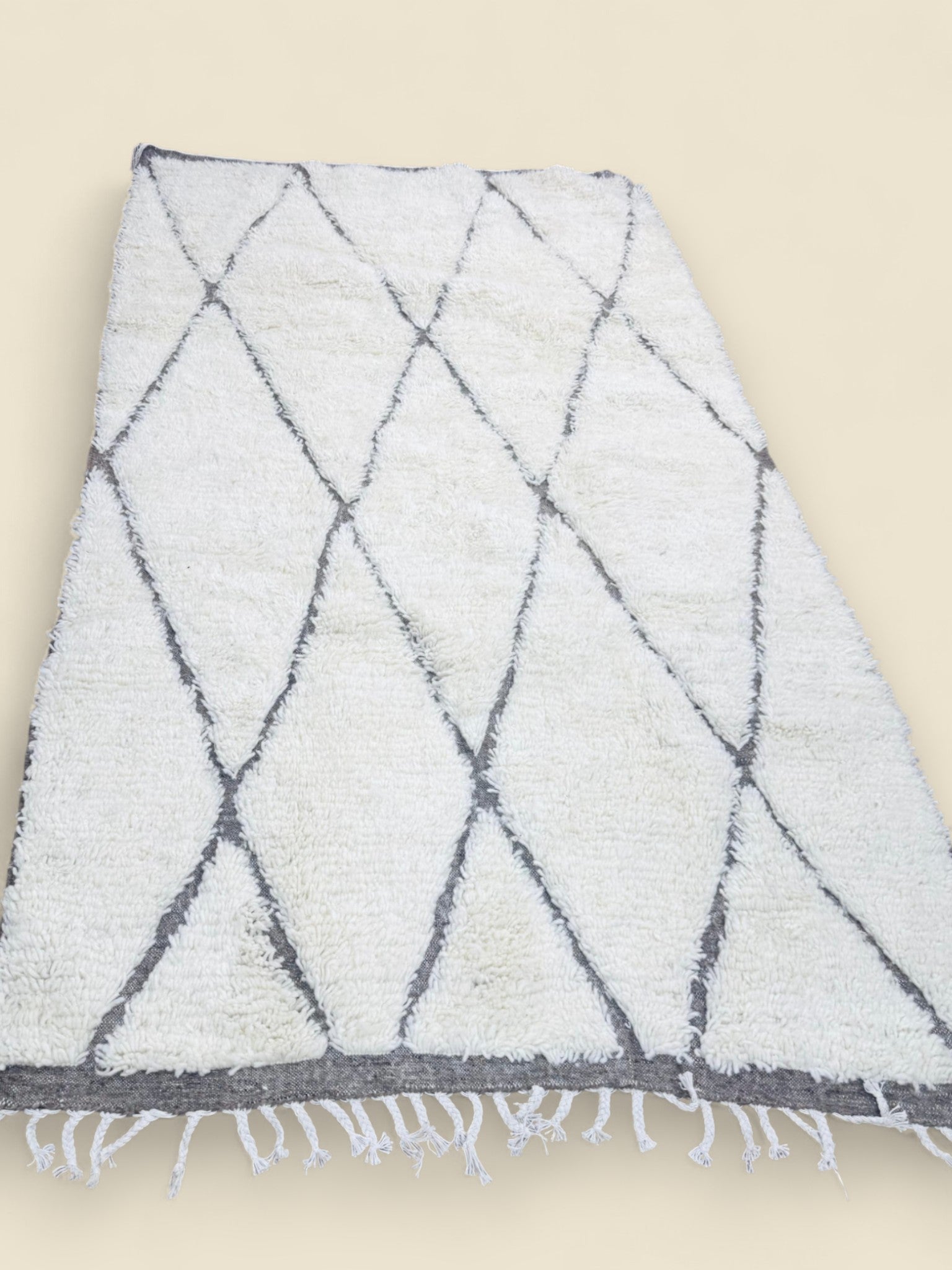 Handmade Tihya Berber rug with grey diamond pattern on cream wool