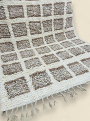 Folded Tilila Berber rug displaying backside weaving details