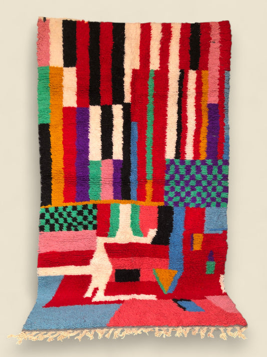 Full view of the Timlilit Moroccan rug with colorful abstract and geometric patterns
