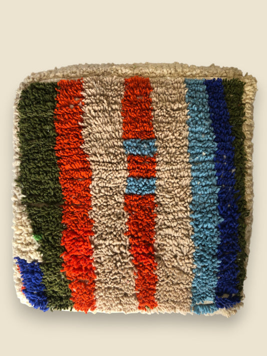 Handmade Moroccan pouffe in orange, blue, and green