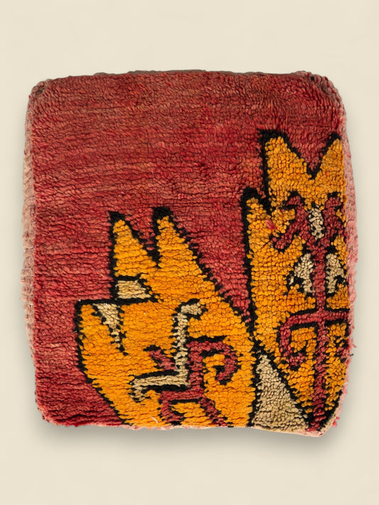 Handmade Moroccan pouffe in red with orange tribal patterns