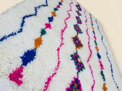 Close-up of colorful geometric details on Moroccan wool rug