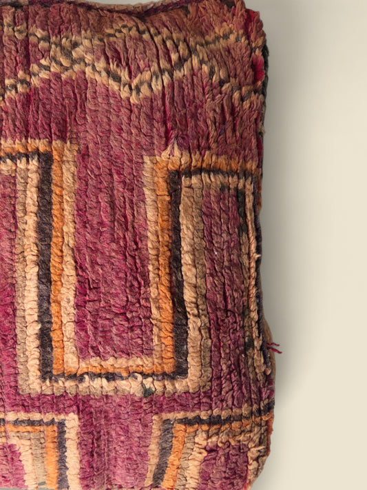 Close-up of wool texture and linear designs on the Tizwit floor cushion