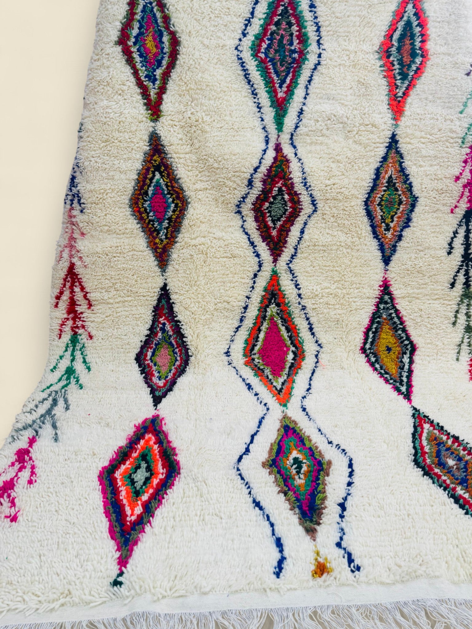 Close-up of Tura Berber carpet with vibrant geometric design