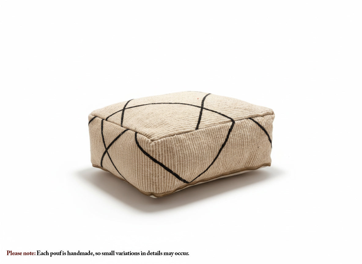 Beige Berber pouf with black geometric lines on a white background