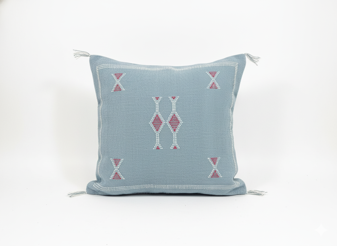 Studio shot of Tanina Berber pillow – light blue with pink geometric embroidery