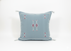 Studio shot of Tanina Berber pillow – light blue with pink geometric embroidery