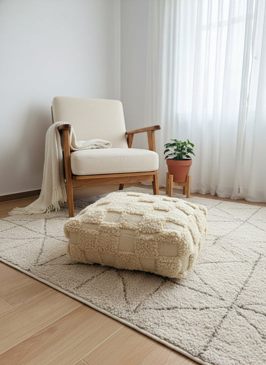 Handmade Berber Azar pouf styled in a minimalist living room