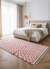 Modern pink checkered rug in bedroom interior
