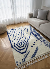 Blue geometric Berber rug with fringe detail
