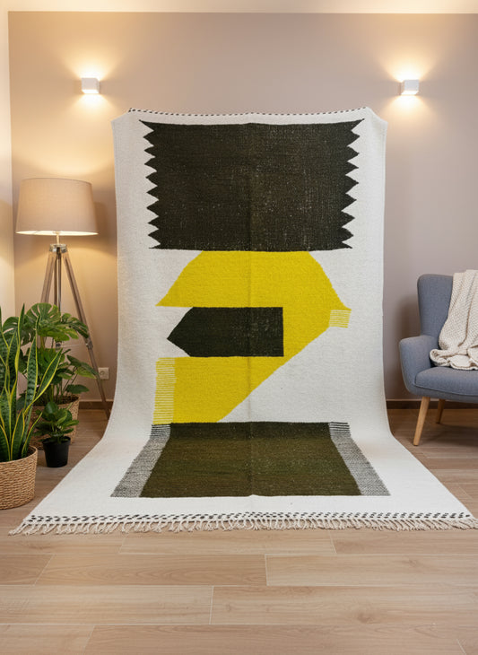 Moroccan Taznurt rug displayed vertically showing bold yellow and olive shapes and fringed edges