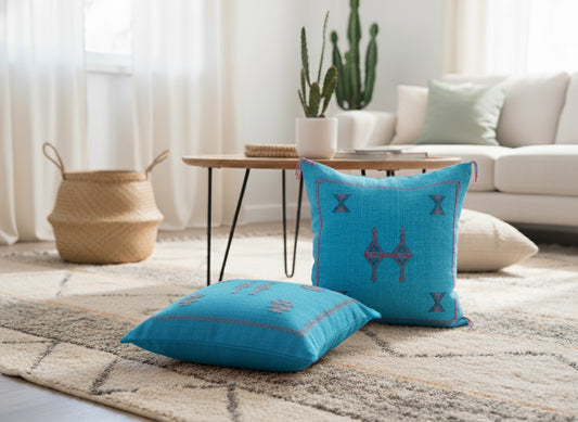 Pair of Tasga turquoise Berber pillows in modern Moroccan living room décor