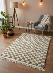 Handwoven Moroccan Timzar Rug with fringed edges displayed in a boho-inspired corner.