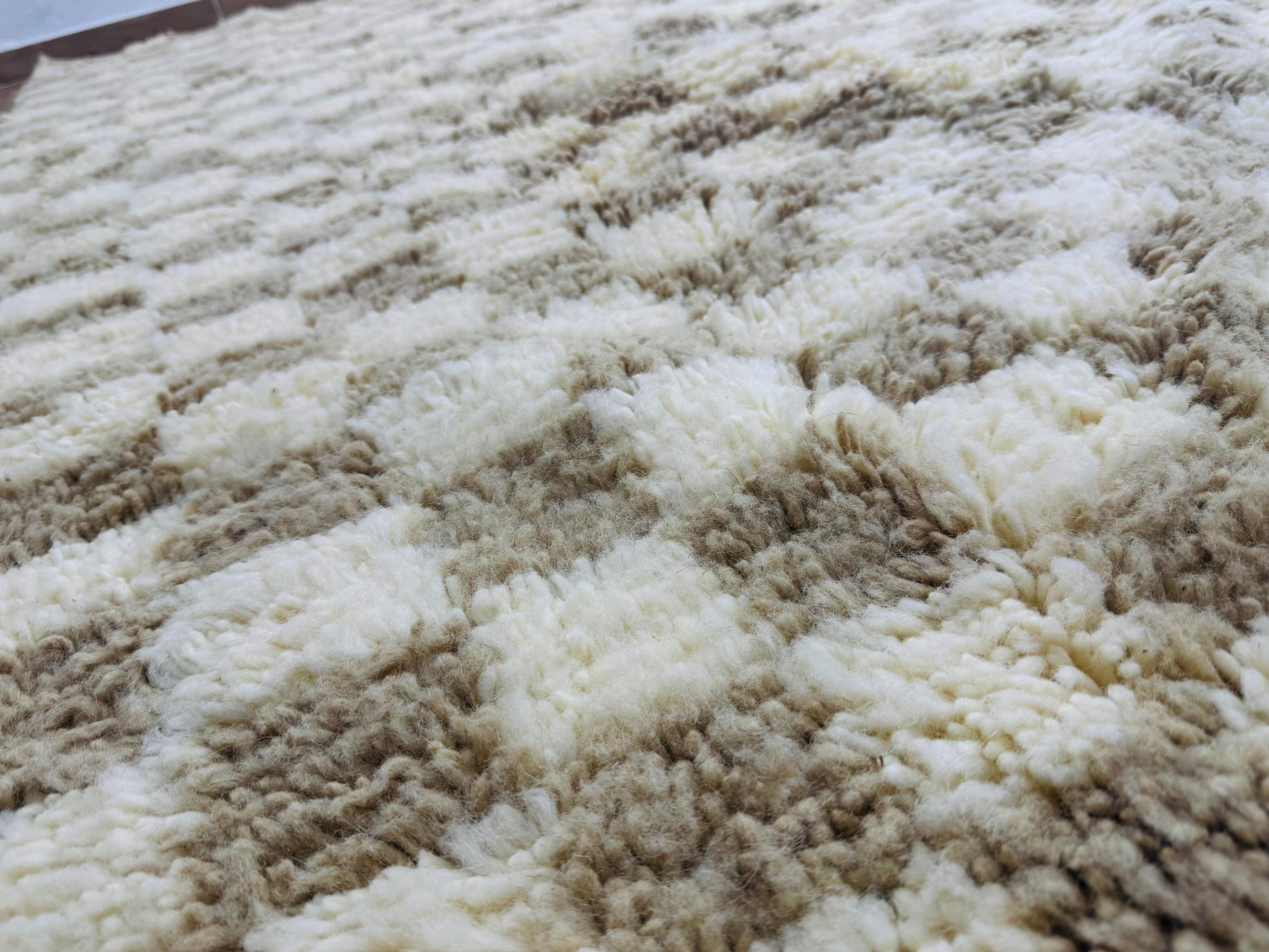 Close-up of the soft wool texture and handwoven checkered pattern of the Timzar Rug.