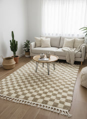 Beige and ivory checkerboard wool rug styled in a cozy Scandinavian living room