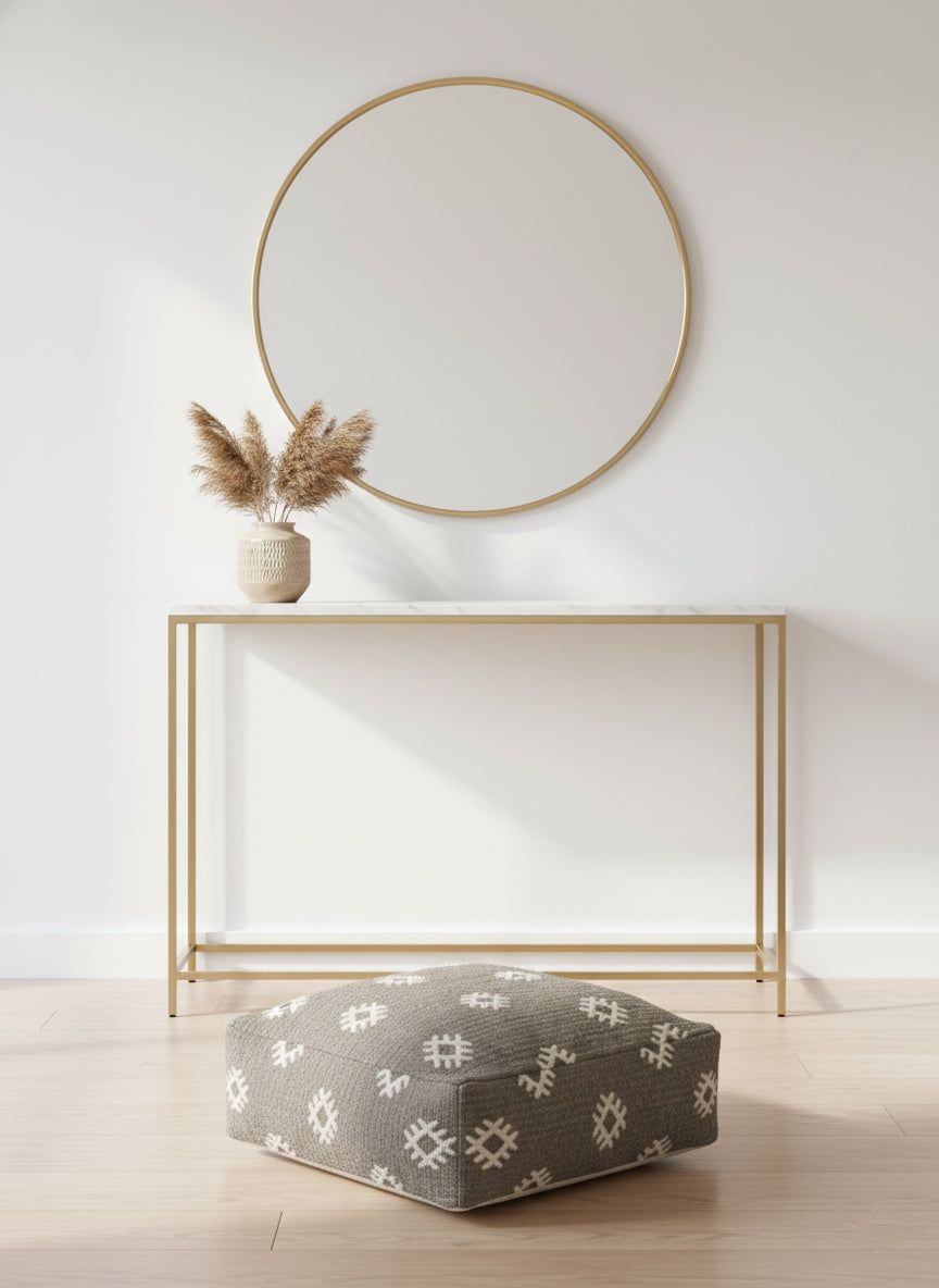Neutral Berber pouf under round mirror