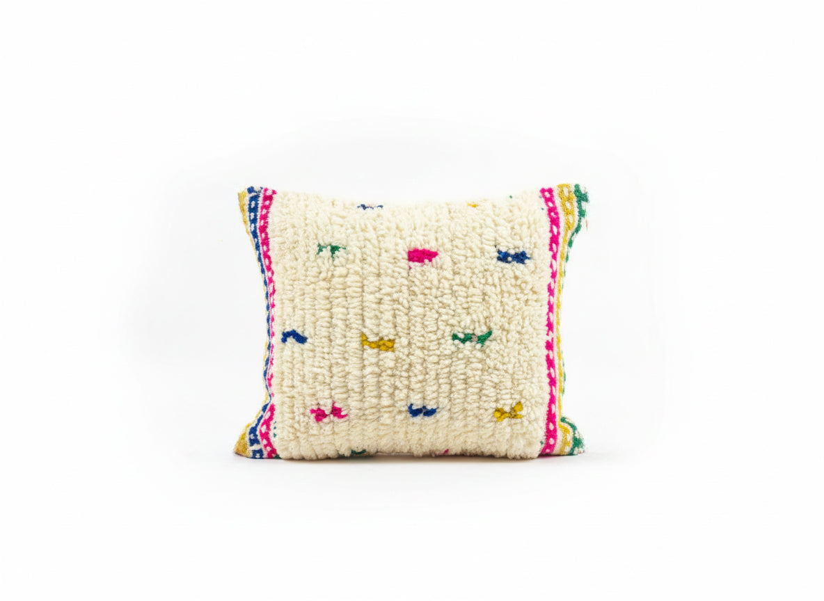 Decorative pillow with colorful patterns on a white background