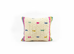 Decorative pillow with colorful patterns on a white background