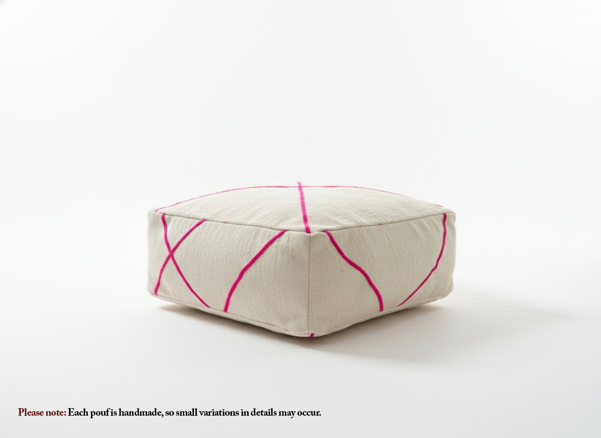 Handmade cream and pink Berber pouf on white background