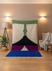 Handmade Moroccan Tissam Berber wool rug with bold green, black, purple, and blue geometric design