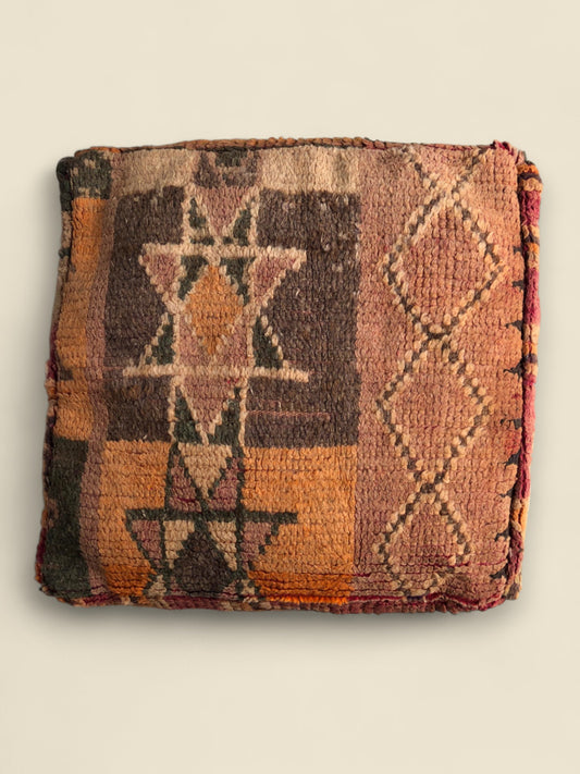 Overhead view of the Thaziza pouffe showing its central geometric star pattern