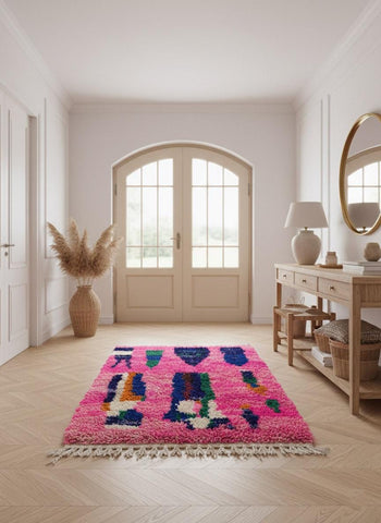 Colorful pink Moroccan rug in entryway