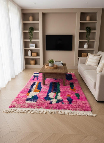 Handmade pink Moroccan rug with colorful geometric pattern