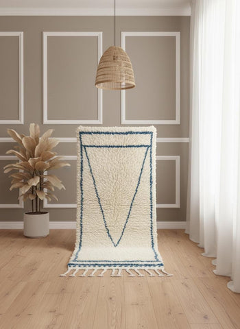 Moroccan Beni Ourain rug displayed vertically with blue diamond design