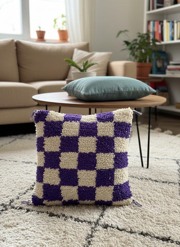 Purple checkered Moroccan wool cushion styled in a modern living room.