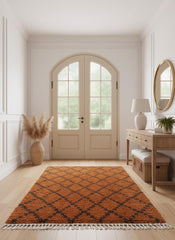 Geometric orange Moroccan rug in entryway
