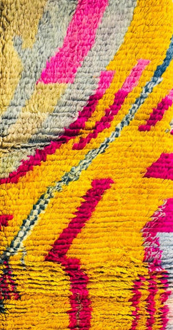 Textured abstract Berber rug with fringe detail