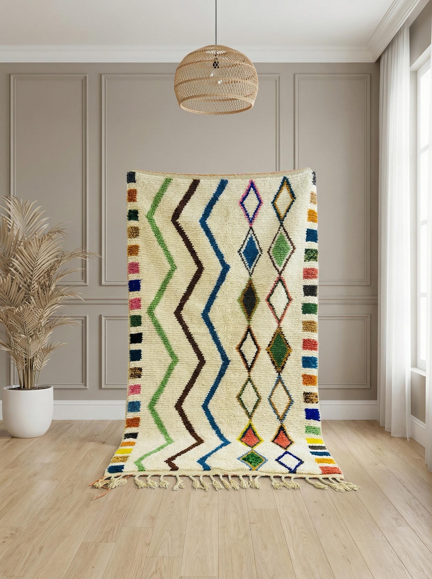 Handwoven Moroccan rug displayed vertically with fringe