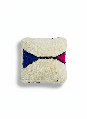 Soft wool texture with bold blue and magenta tribal accents, handcrafted by skilled Moroccan artisans.