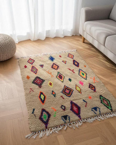 Moroccan wool rug with diamond pattern and tasseled fringe
