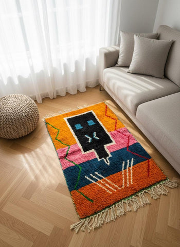 Bold abstract Berber rug styled by fireplace